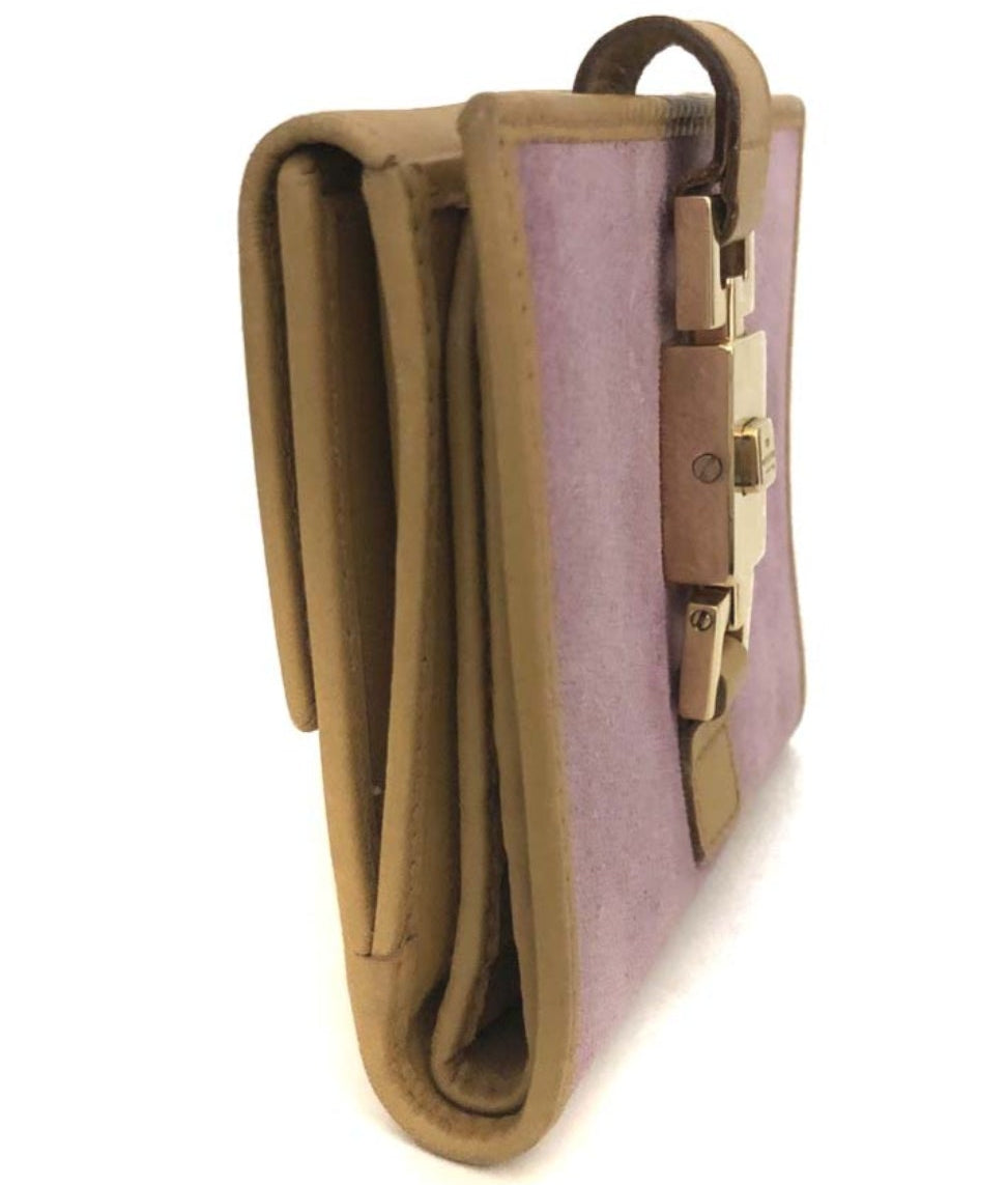 The Gettin Place GUCCI lavender suede and tan leather bi-fold wallet with a gold-tone piston closure, side view.