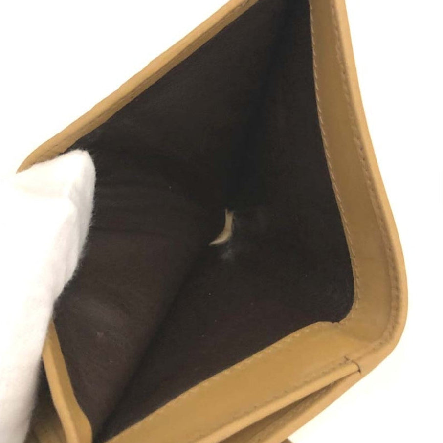 The Gettin Place GUCCI suede leather bi-fold wallet interior view showing dark brown lining and tan leather trim
